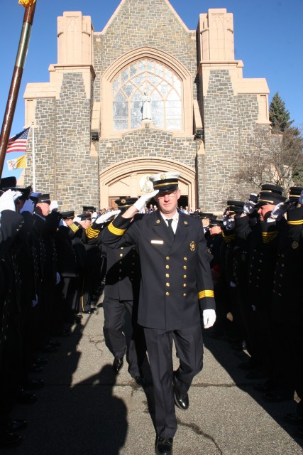 Chief Mannion is welcomed by members of the Department leaving church at our annual communion breakfast